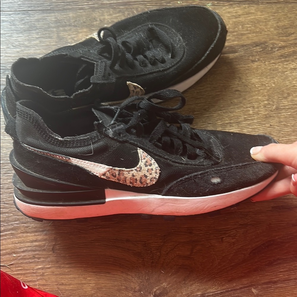 Black Nike with cheetah print. size SIX.5 worn a few times.